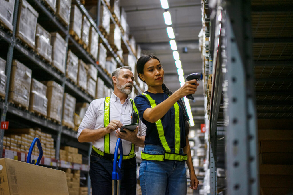 Logistics employees are working warehouse. Labor and logistics.