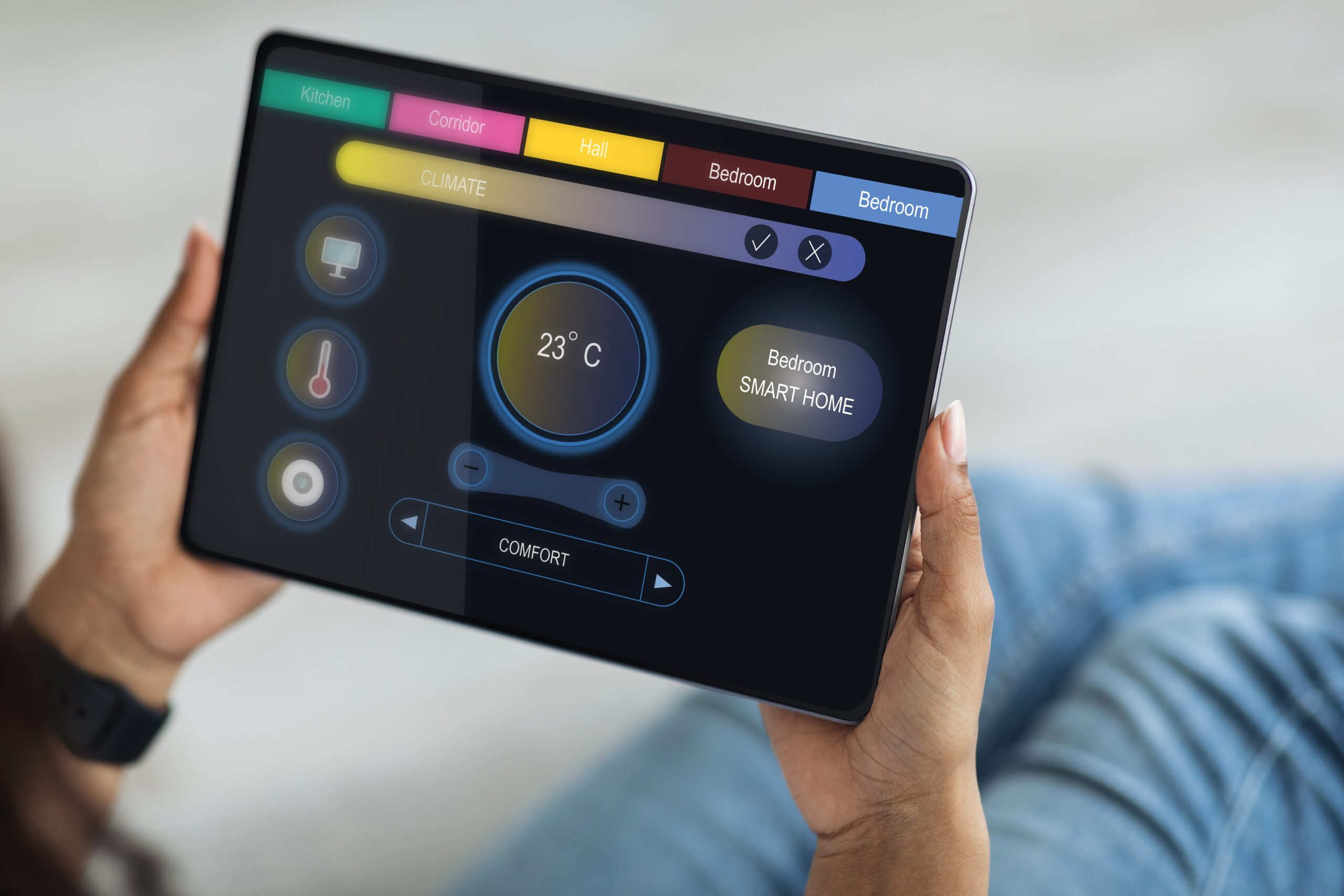 User managing IoT-enabled devices through a smart monitoring dashboard on tablet